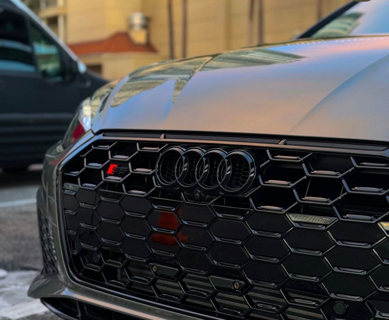Glossy vehicle being detailed in a premium workshop